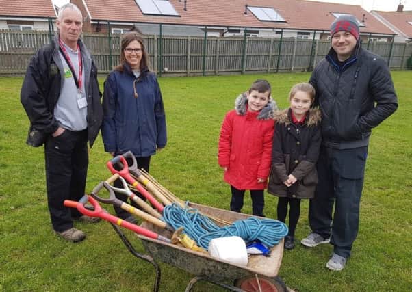 (Left to right) John Swallow, Claire McDonald, Harrison Mekins, Alisha Atkinson and Teaching Assistant Liam Carroll in front of the part of the school field which will become the nature reserve.