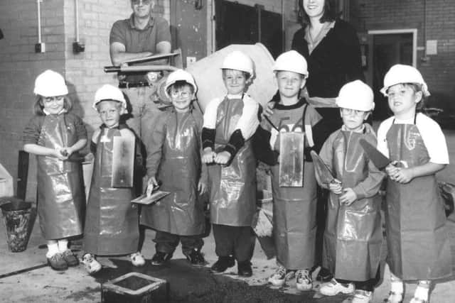 Hartlepool Mail scanned hard copy June 1997 no old ref number  
Pupils from Ward Jackson Primary School aged four to six visited the brickworkshop at Stockton Street Campus of Hartlepool Further Education.  Left to right:  Samantha Smith, Aaron Brady, Scott Dolman, Paul Thompson, Joe Langley, Vincent Matthews, Jodie Robinson with lecturer Peter Kirkpatrick and teacher Alison Fisher.