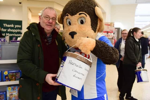 Hartlepool United Supporters Trust chairman Ron Harnish with Pools mascot H'Angus