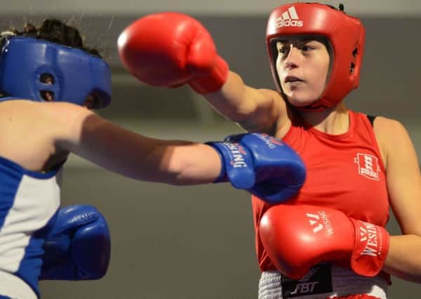 Danielle Marshall (red) in action against Charlie Horgan of Ryston Boxing Club, Ireland.