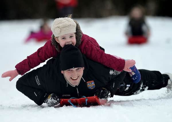 Ian Anderson (38) with his daughter Faith (5) sledging in Burn Valley Park. Picture by FRANK REID