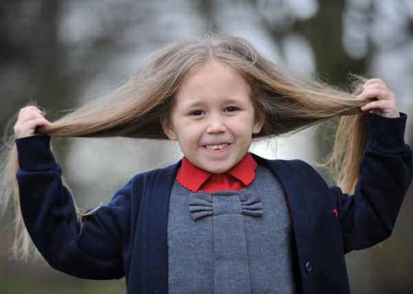 Sophie Barrone has her hair cut in raise funds for the Little Princess Trust.
