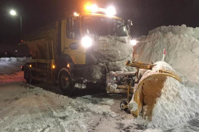A snow plough works to keep the road clear at Medomsley crossroads near Consett, County Durham.