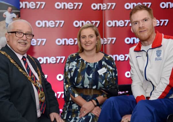 Mayor of Hartlepool Councillor Paul Beck and chair of trustees Pamela Hargreaves welcome Paralympic medalist Stephen Miller MBE to Families First North East.