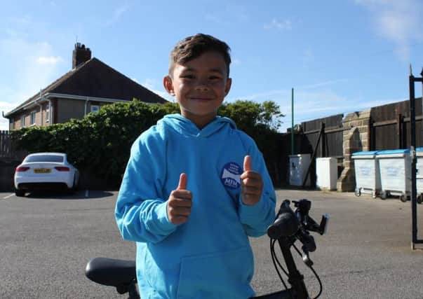 Lewin Tubuna will take on an epic cycling challenge for charity.