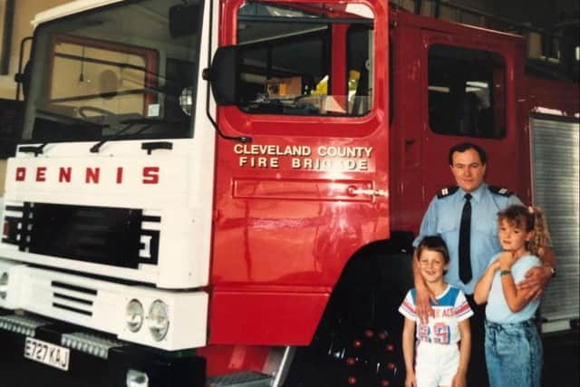 Billy Constantine in his fireman days with his children Rachel and Paul.