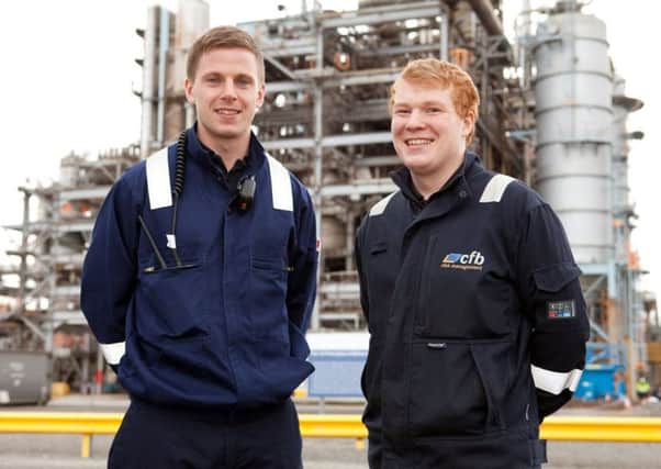 Steven Barnfield (left), one of 10 apprentices on the second course run by CFB Risk Management is welcomed to the Ineos Nitriles site by Jack McTiernan who successfully completed one of the first apprenticeships and is now a Site Protection Officer.