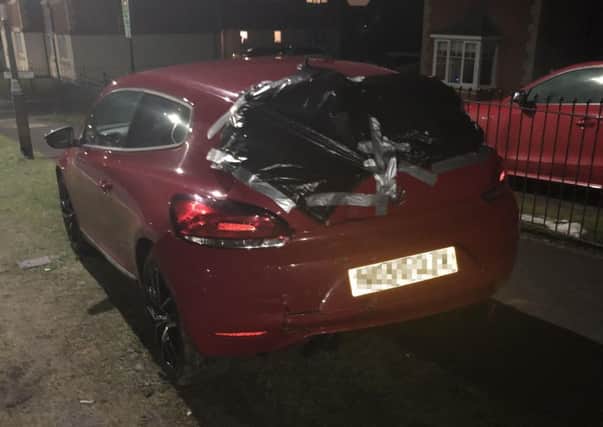 The damaged VW Scirocco after being hit while parked on Merlin Way.
