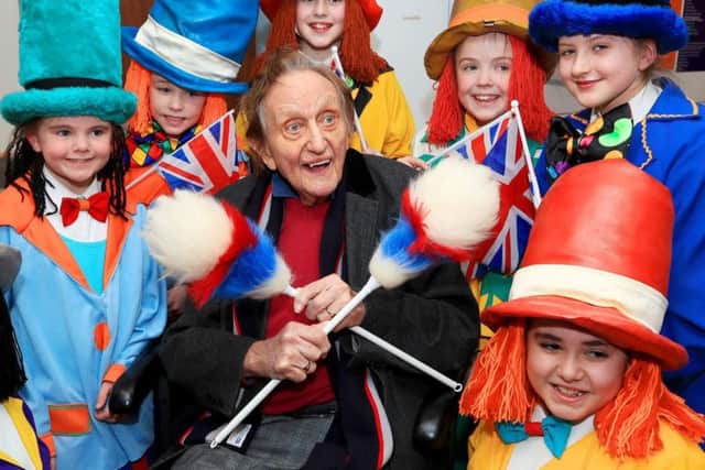 Sir Ken Dodd surrounded by Diddymen.