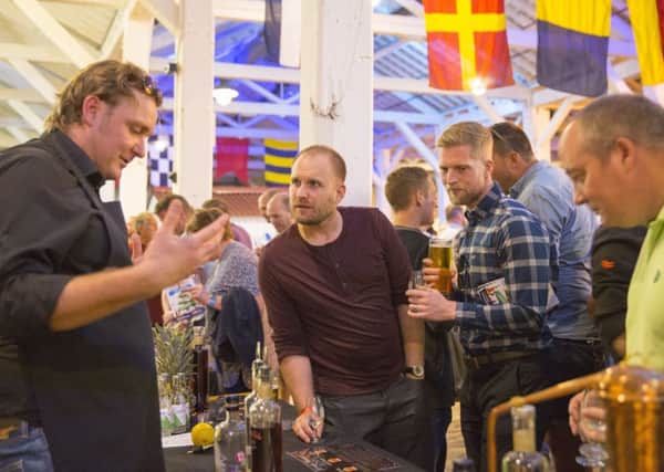 Visitors enjoy themselves at a rum festival held at NMRN Portsmouth.