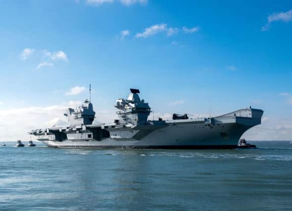 The HMS Queen Elizabeth returns to Portsmouth Harbour after sea trials. Photo: Steve Parsons/PA Wire.