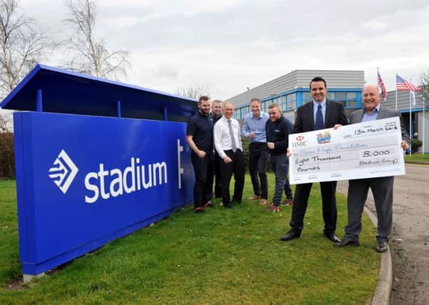 Chris Short (front left) with Saras Hope Foundation vice chair Alan Gray and (rear from left) Stadium Group's Andrew Davis, Dave Collier Martin Waite, Mark Sunley and Peter Jones.