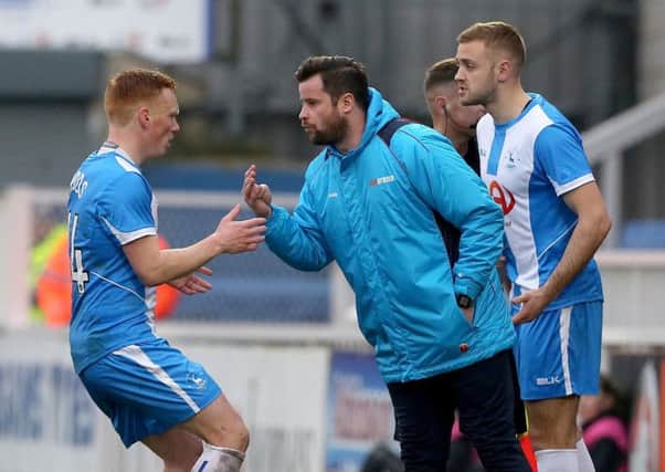 Matthew Bates gives instructions to Michael Woods during the Boreham Wood match. Picture: Mark Fletcher/Shutter Press.