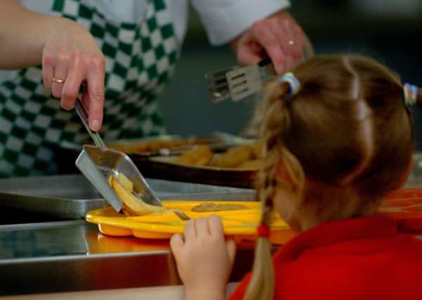 Fewer children in poverty will be eligible for free school meals under changes to Universal Credit. Chris Radburn/PA Wire