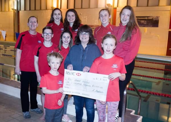 Members of Aquaforce Swimming Academy raised Â£1,000 taking part in Alice House Hospices Santa Fun.