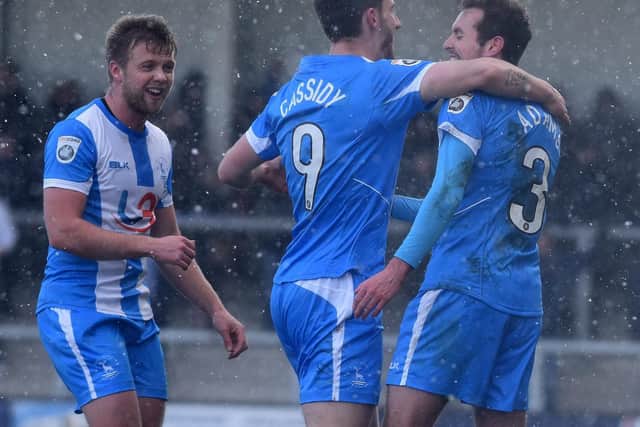Jake Cassidy, Blair Adams and Nicky Featherstone celebrate Pools' opener.