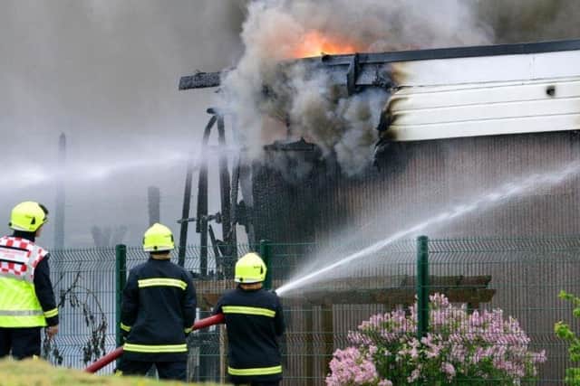 Firefighters battle the blaze as it took hold of the nursery building.