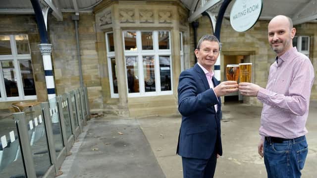 Chris Cunningham, general manager for Virgin Trains (left) with Graeme Robinson owner of The Waiting Room Ale House, Durham Train Station.