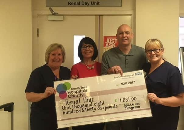 Kevin and Julie Musgrave, centre, hand over more than Â£1,800 to the Renal Unit at James Cook University Hospital.