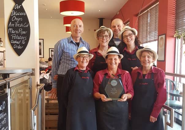 Hartlepool Mail chippy of the year winner Mary Lambert.

Pictured: (front) Gill Mead, Sharon Henderson, Christine Armstrong, (middle row) Philippa Lambert, Angela McIntyre, Eric Lambert and (back)
Keith Usher.