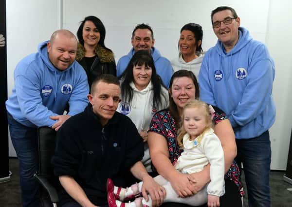 Dottie O'Keefe, four, with mum Helen Noon and dad Danny O'Keefe with members of Miles for Men and Walk for Women who gave a massive boost to the Â£35,000 appeal