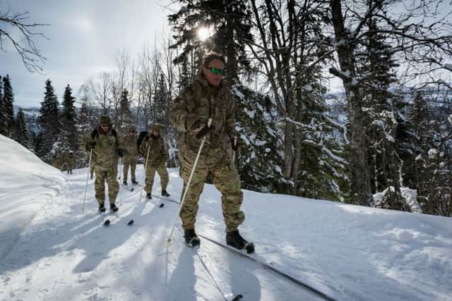 A group of reservists climb towards their training area in Rjukan, Norway.