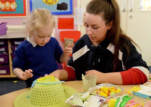 Eskdale Academy pupil Dakota Hornsey, five, working on her Easter Bonnet with a little help from mum Sarah, 24.