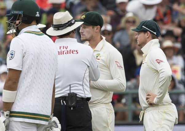 Cameron Bancroft of Australia talks to the umpire on the third day of the third cricket test between South Africa and Australia at Newlands. Picture: AP/Halden Krog