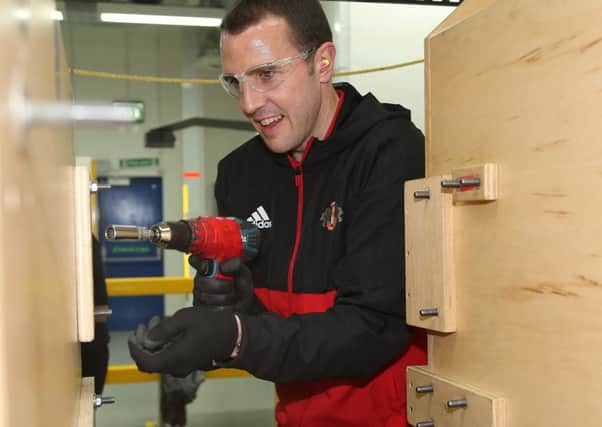 John O'Shea gets stuck in at Peterlee's Caterpillar plant. Picture by Ian Horrocks