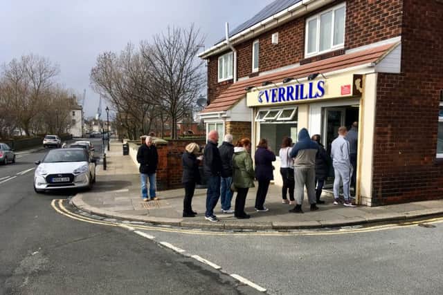 People queuing for Good Friday fish and chips outside Verrills on the Headland