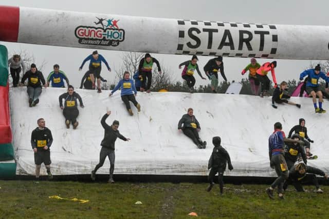 Runners taking part in the 5K Gung-Ho! run/obstacle at Wynyard Hall.