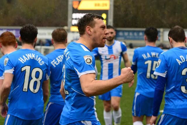 Skipper Carl Magnay celebrates in front of Pools' fans.