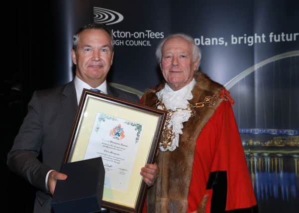 Chris Musgrave is presented with his award by mayor Councillor Maurice Perry.
