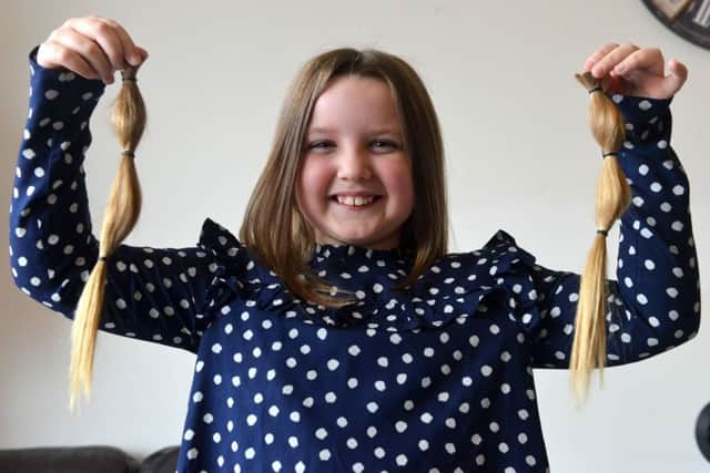 Violet Richardson aged 8 has her hair cut for Little Princess Trust.