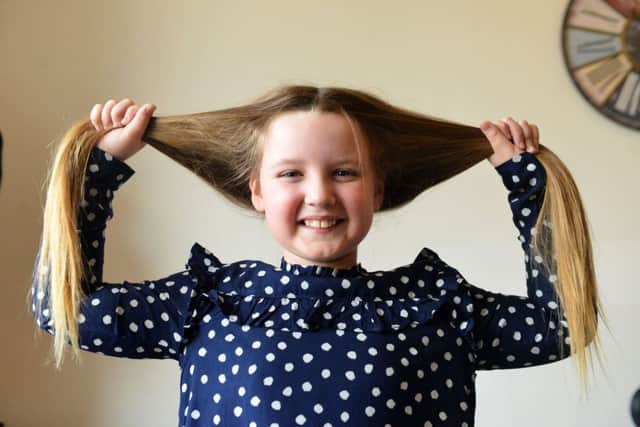 Violet Richardson aged 8 has her hair cut for Little Princess Trust