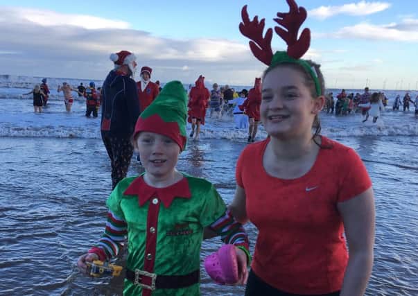 Tilly Denning, left and sister Harriet after doing last year's Boxing Day Dip.