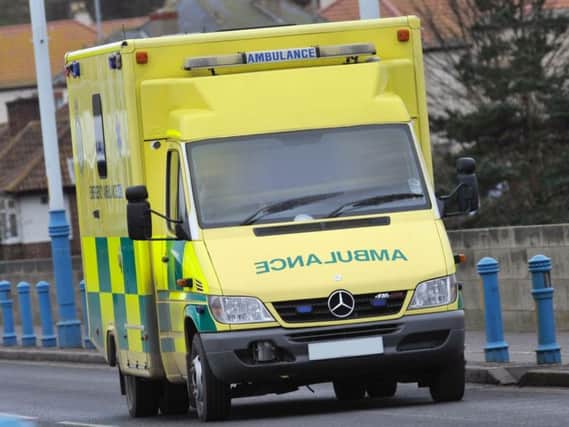 Police have appealed for help after an ambulance driver was threatened