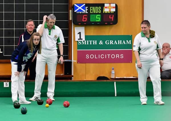 (left to right) Emma McIntyre Scotland with Ian and Alison Merrien MBE in the final of the World Indoor Bowls Championship mixed pairs held at the Hartlepool Indoor Bowls Centre. Picture by FRANK REID