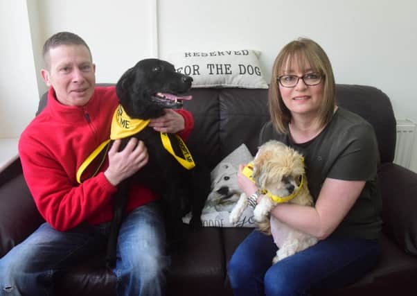 Dogs Anna and Didi ave found themselves new homes thanks to the  Doggie Diner Blackhall  adoption day event.
Pictured with Lee Henderson of Stray Aid and franchise director Adrienne Dickson.