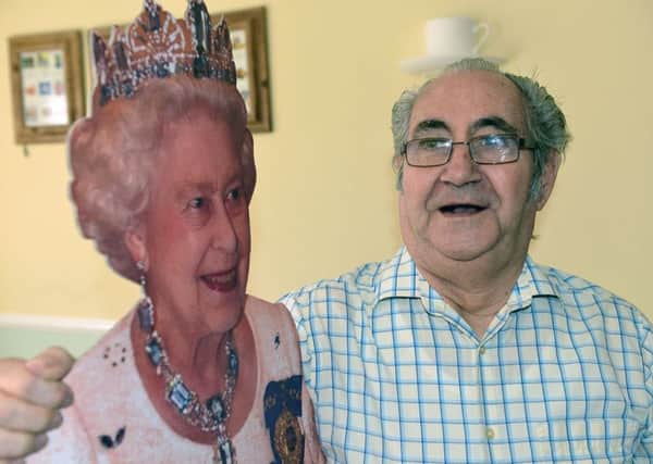 Field View Care Home resident Stan Spowart getting up close and personal with HM Queen Elizabeth. Picture by FRANK REID