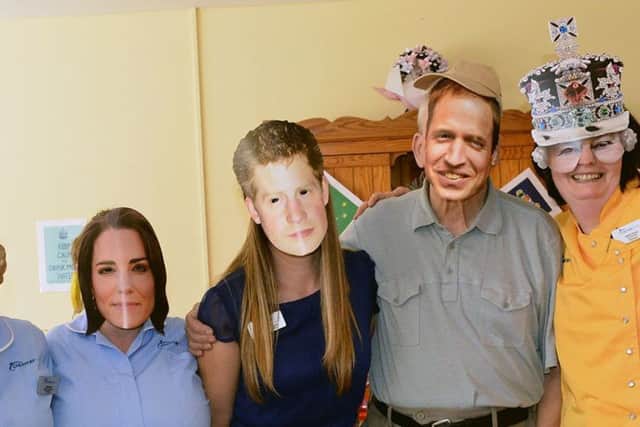 Field View Care Home resident Bill Simkins (3rd Right) with staff members (left to right) Deborah Molloy, Ann Sewell, Sharon Quinn, Helen Carter, Janice Hardy and Ashley Bewick wearing their royal family masks. Picture by FRANK REID