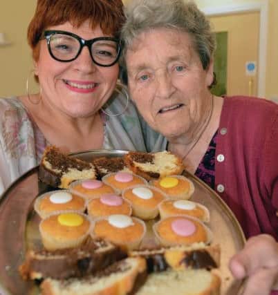 Field View Care Home manager Michelle Howarth (left) with resident Jean Drew before they tuck into their selection of cakes. Picture by FRANK REID