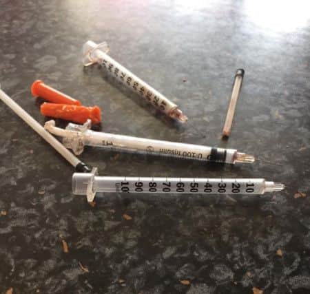 The syringes found in the faamil's garden.