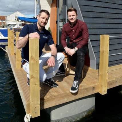 Luke Robertson (right) with Adam Henderson enjoying the sunshine on the decking. Picture by FRANK REID