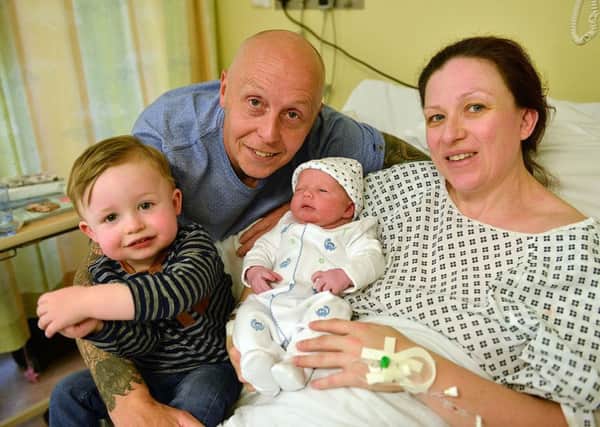 Michelle Swinburne (39) with her partner Doug Moore (46) and son Charlie Moore (19 months) with their new born son baby Moore born at North Tees Hospital. Picture by FRANK REID