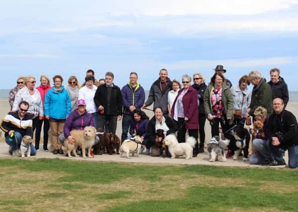 Friends and family of Don Stephenson - and their pooches - take part in the dog walk in his memory to raise money for Alice House Hospice.