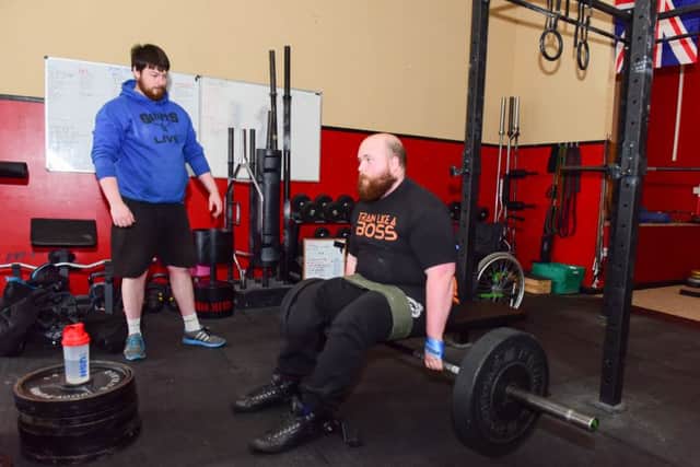 Training to become Britains Strongest Disabled man, Stephen Trotter pictured with coach Thomas Parkin (left), at Fitness Affinity, Whitby Street South, Hartlepool.