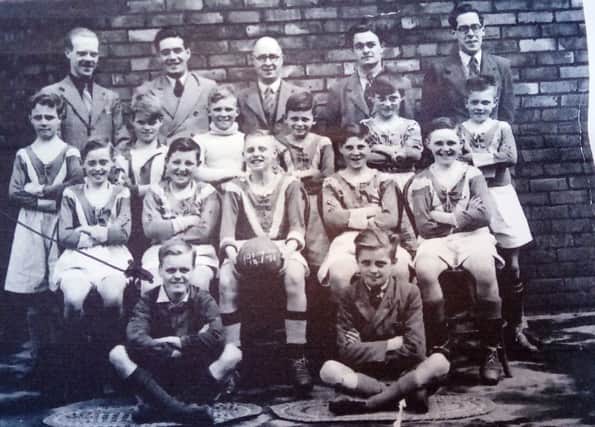 The Brougham Primary School 1947 footbal team with Joe Richmond pictured, front left.