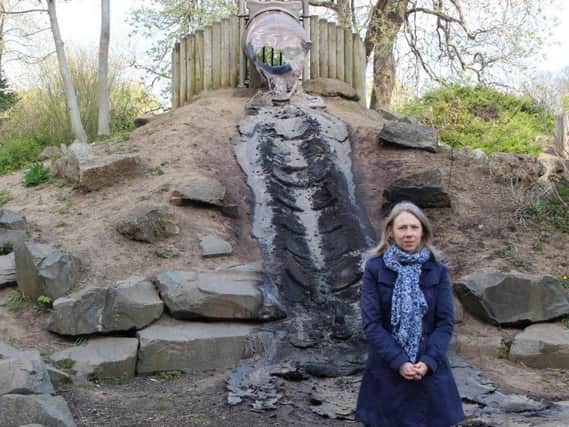 Sarah Scarr, the councils heritage and countryside manager, beside the destroyed slide at Burn Valley Gardens.