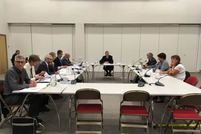 Local Plan inspector David Spencer (centre) hears submissions from Hartlepool Borough Council officers (left) and wind turbine objectors (right).